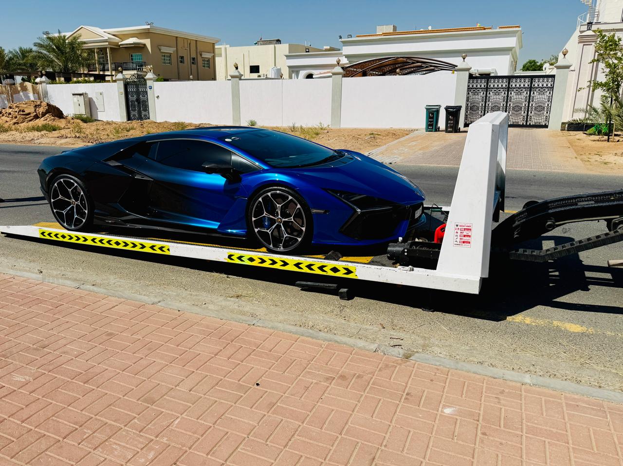 Sports car recovery Dubai - Lamborghini Revuelto on full down flatbed