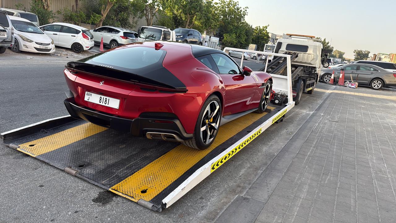 Supercar recovery Dubai - Ferrari 12Cilindri on flatbed recovery truck