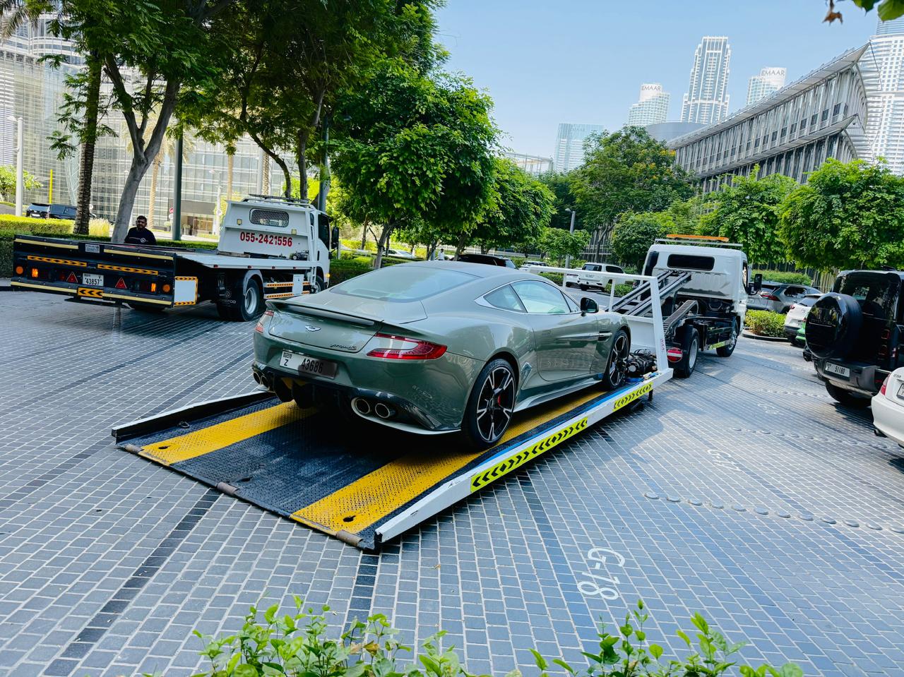 Aston Martin Vanquish on a flatbed luxury car recovery in Downtown Dubai